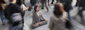 A busy executive sitting in a lotus position during rush hour, achieving piece of mind because she uses easy work order's enterprise saas to manage her portfolio of commercial real estate