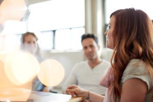 Executive discussing easy work order's enterprise saas benefits to her employees